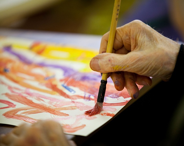 Elderly person doing creative art therapy