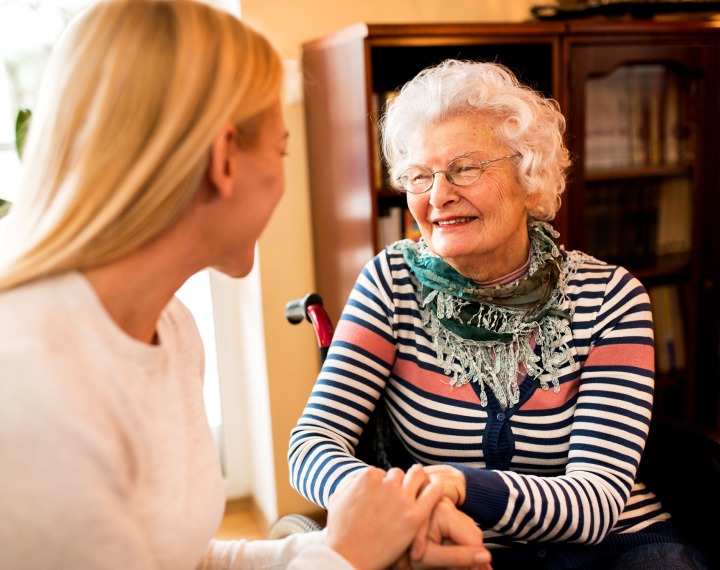 Elderly resident meeting with family