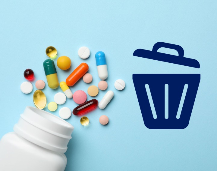 Medication tablets beside bin