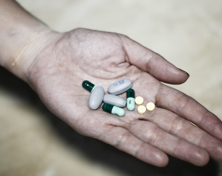 Hand holding pills