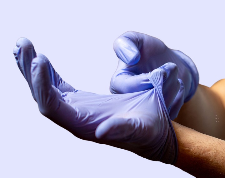 Person removing glove in the correct way