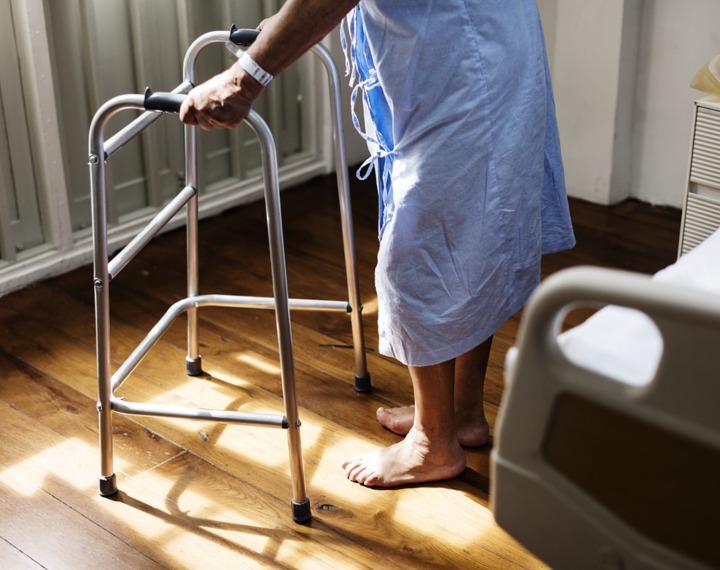 Senior using a walking aid to help them walk