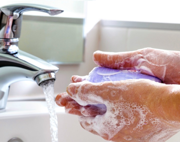 Washing hands with bar of soap