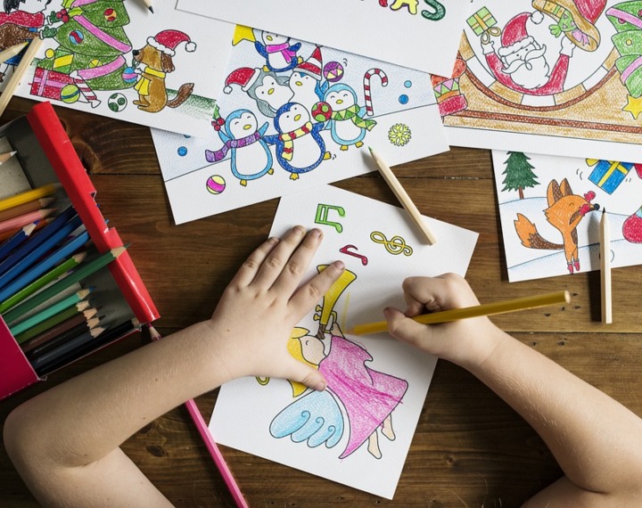Child doodling and colouring