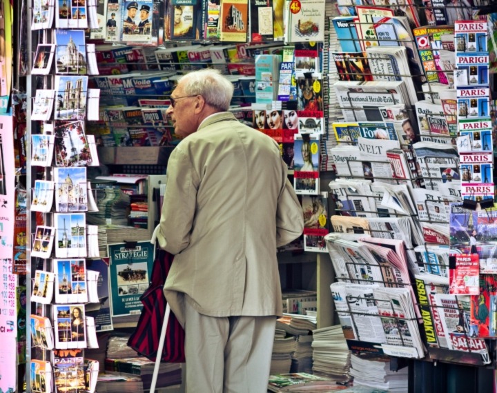 Senior looking at cards
