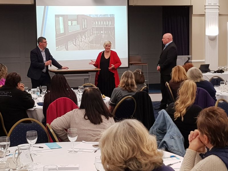 John Leary of CLH discussing the table with dementia specialist, Dr Sam Davis