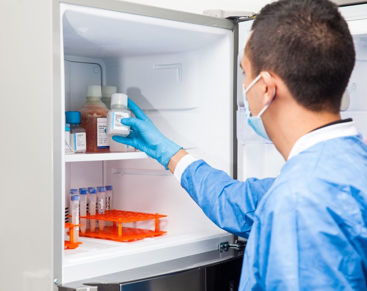 Man looking in medicine cabinet